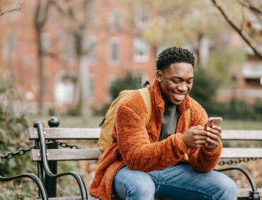 Photo by Keira Burton: https://www.pexels.com/photo/delightful-african-american-man-surfing-modern-cellphone-in-city-park-6146929/